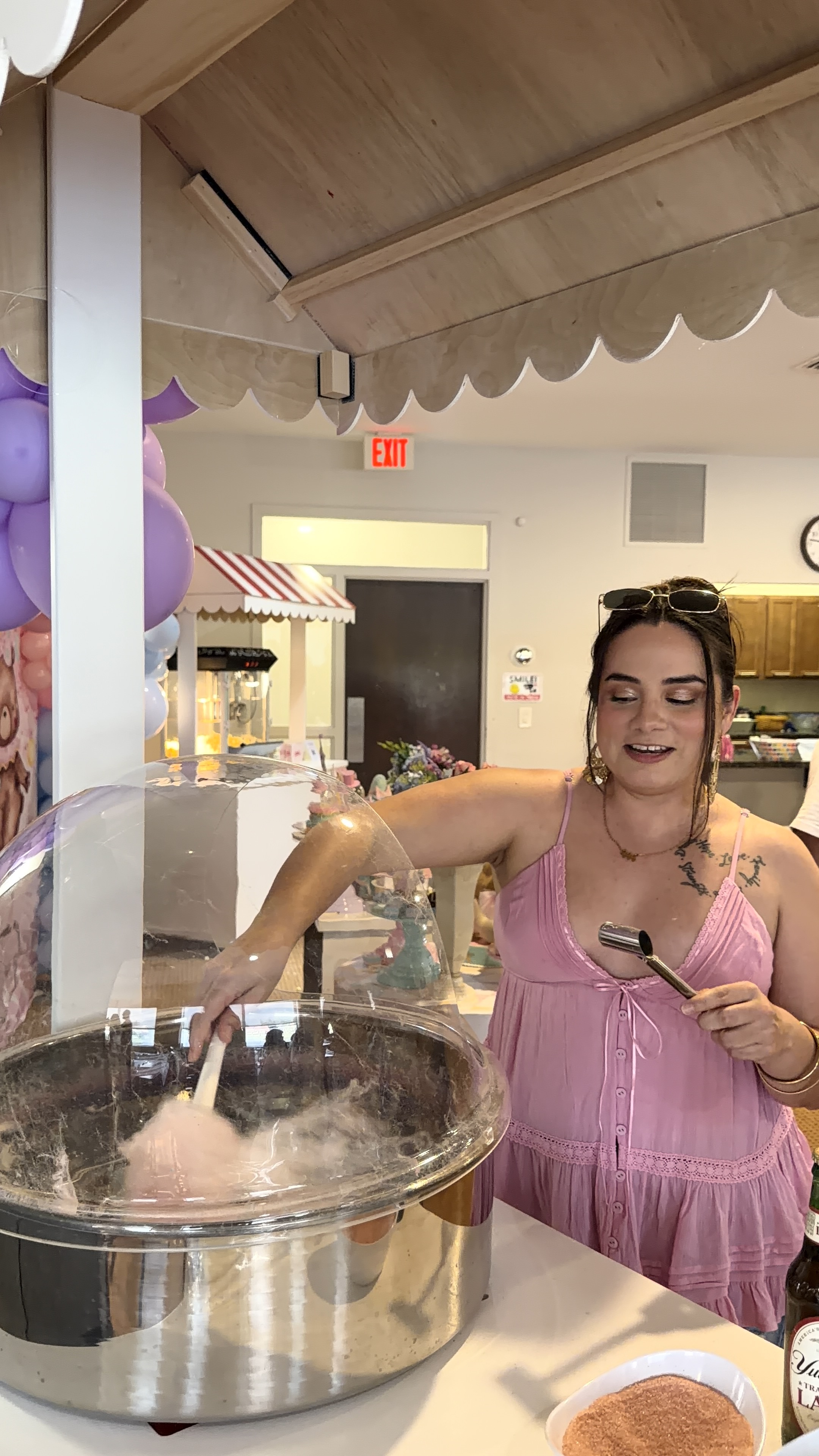 Fresh fluffy cotton candy being hand-spun live at event treat cart